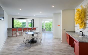 Kitchen and dining room with a table and chairs